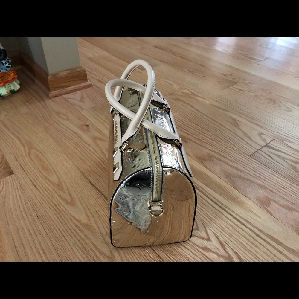 MICHAEL KORS KARA LG DUFFLE SATCHEL PALE GOLD NWT. Measures approximately 10x6.